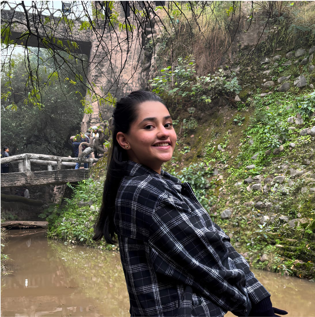 A Twofold Media founder photographed by a garden bridge